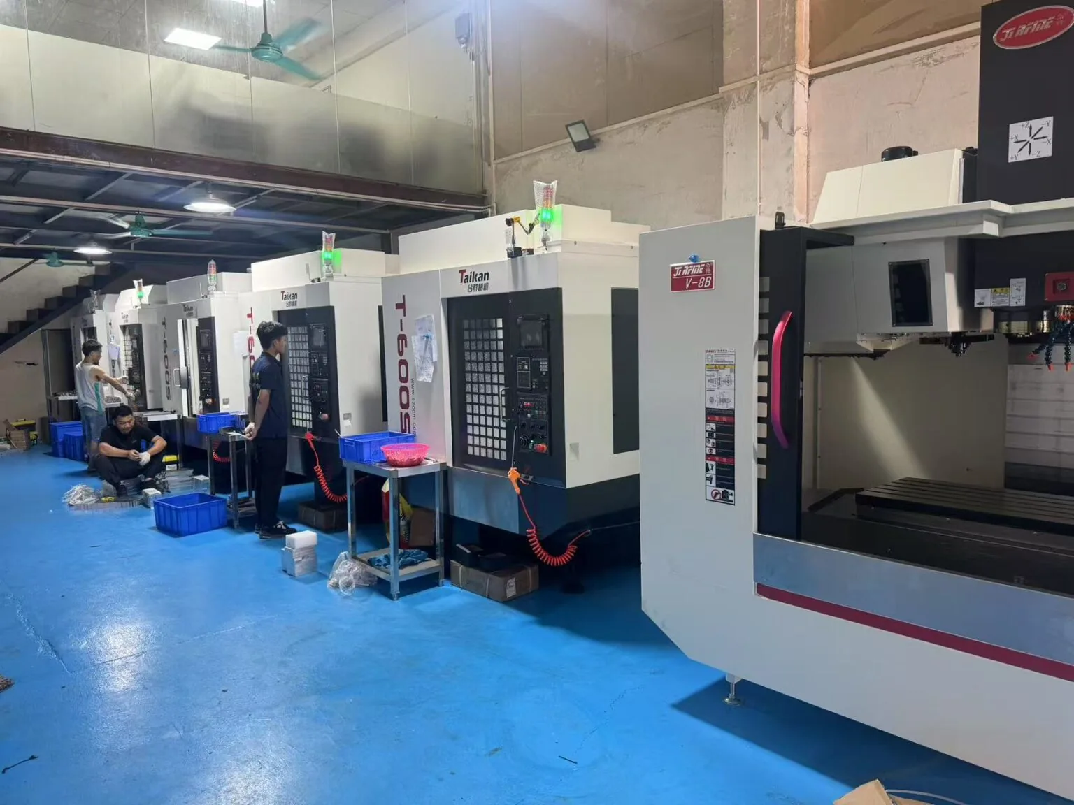 Row of Taikan T-600S and V-8B vertical machining centres on the GY Machining shop floor in Dongguan